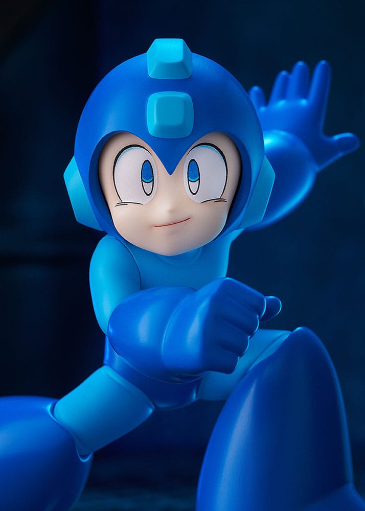 Close-up of Pop Up Parade Mega Man figure's smiling face and helmet, dark backdrop