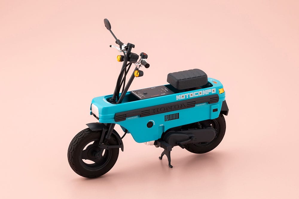 Aoshima 1/12 Honda AB12 Motocompo scooter in turquoise with handlebars up, three-quarter view