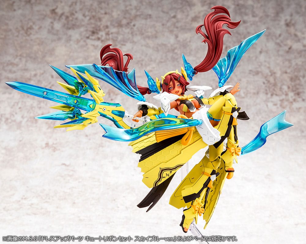 Megami Device Ame No Uzume Sunshine in dynamic flying pose with blue and yellow wing armour spread out