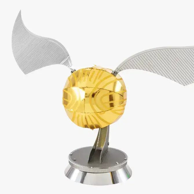 Metal Earth Harry Potter Golden Snitch 3D metal model kit shown assembled with gold ball and silver wings
