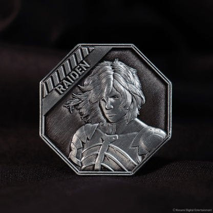 Metal Gear Solid 2 Raiden coin on a dark background, front face with Raiden in relief