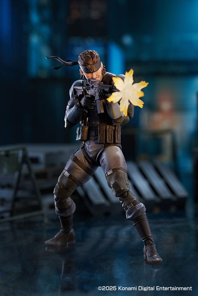 figma Solid Snake firing the assault carbine in a warehouse scene with muzzle flash