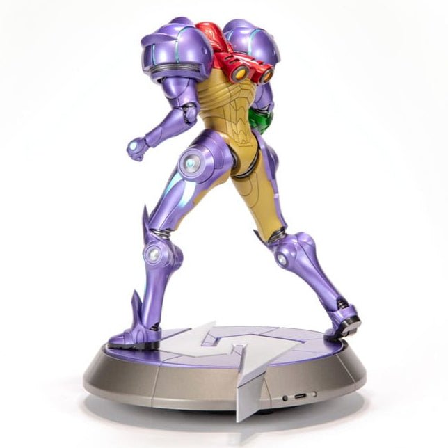 Samus Gravity Suit statue, left rear three-quarter view mid-stride on the emblem base