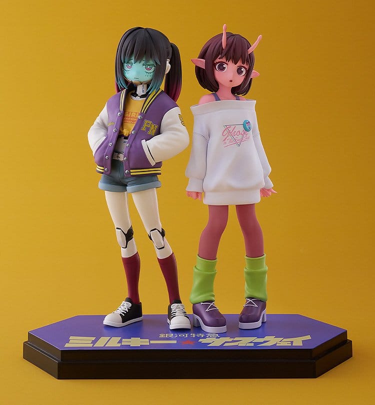 Chiharu & Makina Pop Up Parade figure pair side by side in jackets and leg warmers, yellow backdrop