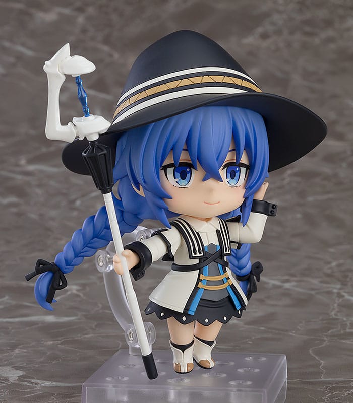 Close-up of Roxy Migurdia Nendoroid with witch hat and staff held aloft on display stand