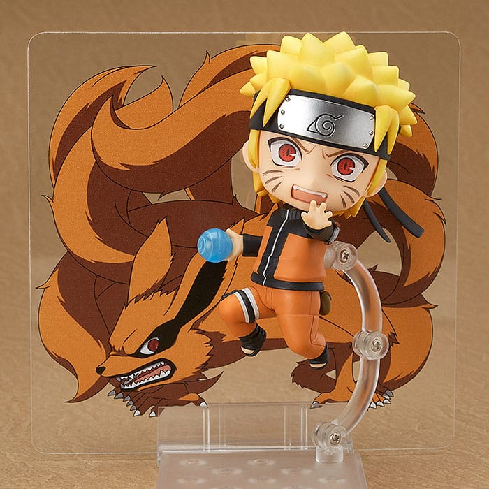 Naruto Uzumaki Nendoroid with Rasengan in front of the illustrated Kurama tailed beast sheet