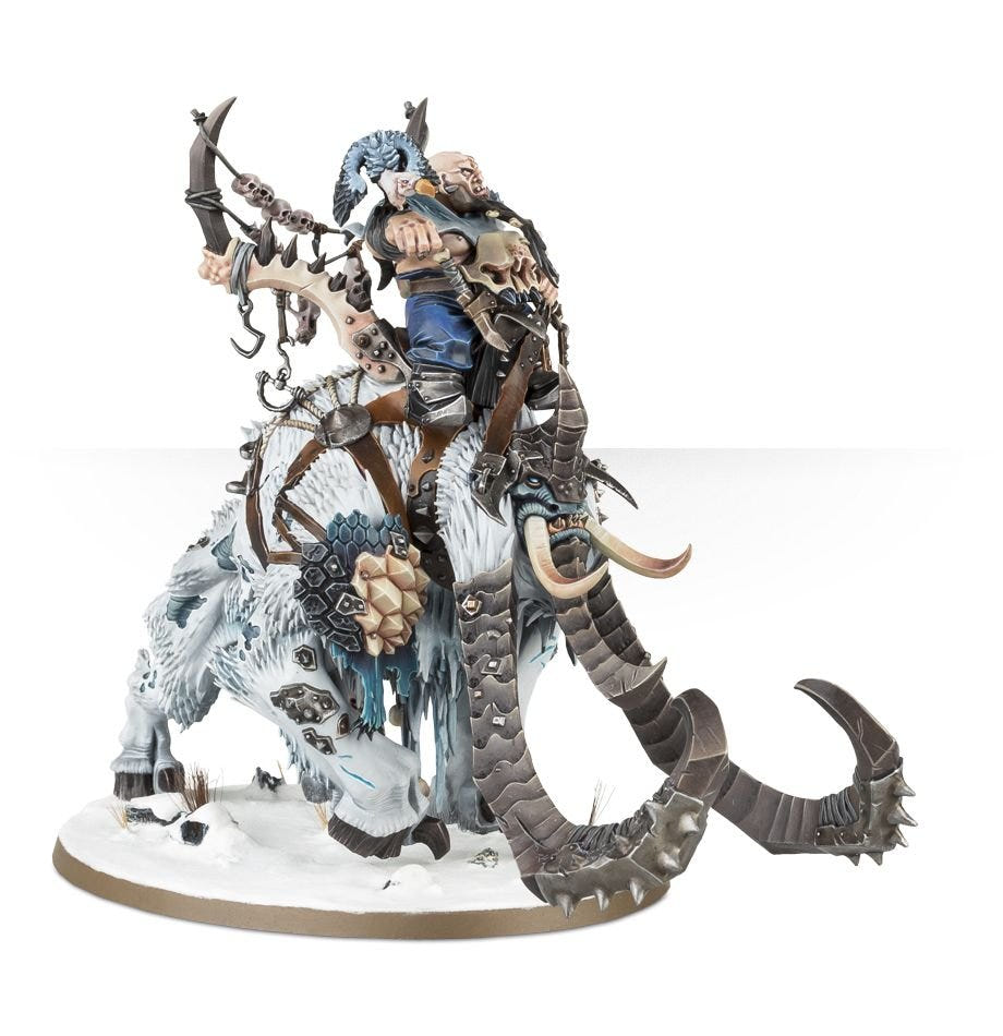 Painted Ogor rider on a white-furred Thundertusk with long curling tusks, close front view