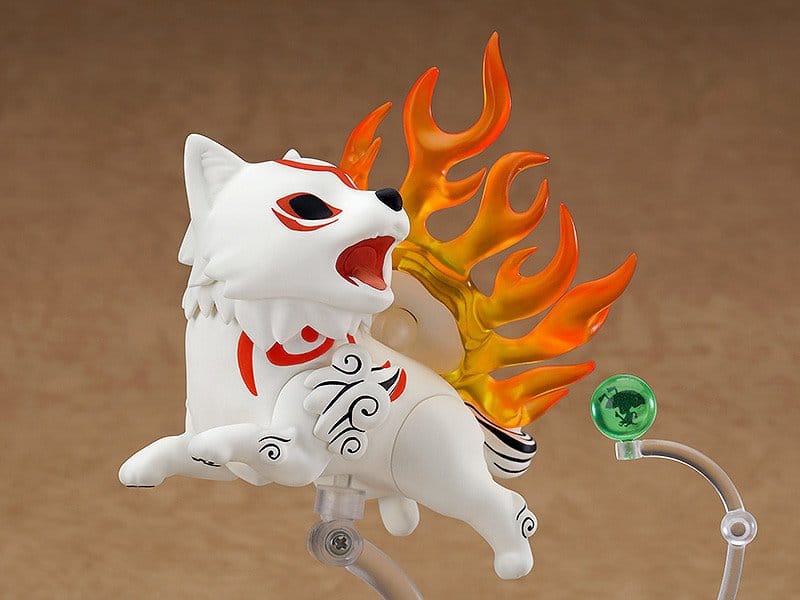 Nendoroid Amaterasu from Okami leaping on a clear stand against a warm brown backdrop