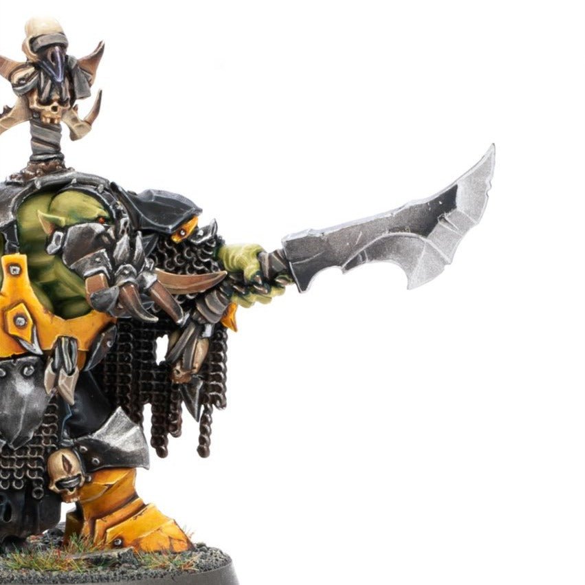 Close-up of the painted Ardboy Big Boss's jagged choppa arm and armoured shoulder