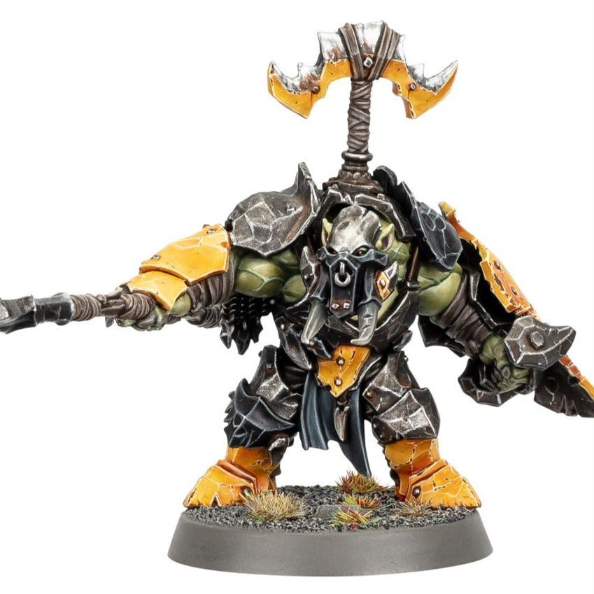 Painted Orruk Ardboy Boss with a glyph-topped helm pointing a stikka, close view