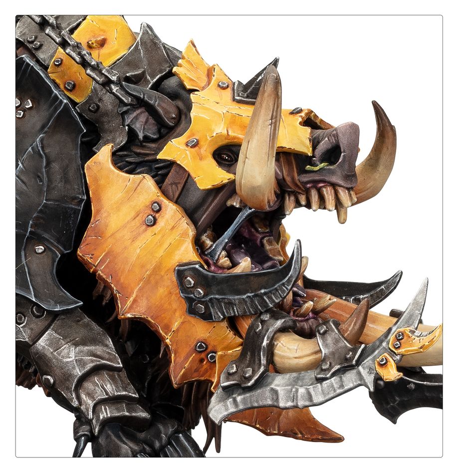 Close-up of the Maw-Grunta's tusked head and yellow armour plates