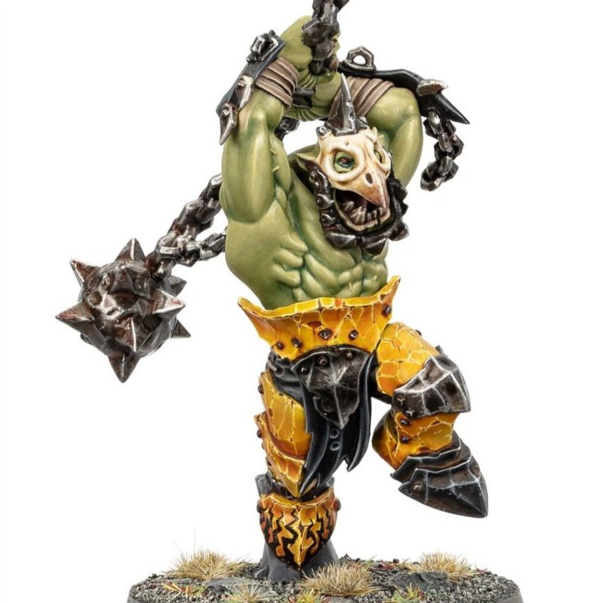 Close-up of a painted Weirdbrute Wrekka in a bone mask raising a chain-smasha flail, yellow Ironjawz armour