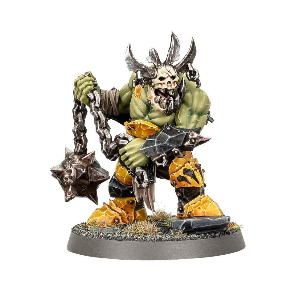 Painted Weirdbrute Wrekka in a horned skull mask hunched over a chain-smasha flail, Orruk Warclans miniature