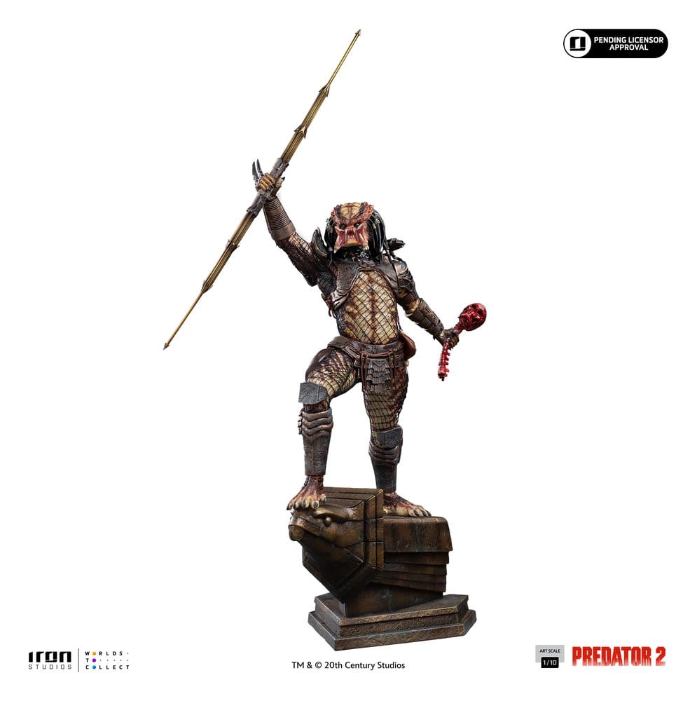 Predator City Hunter 1/10 statue unmasked, raising spear and skull, three-quarter view