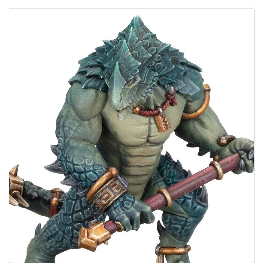 Close-up of a painted Seraphon Kroxigor's crested head and arms bracing a drakebite maul