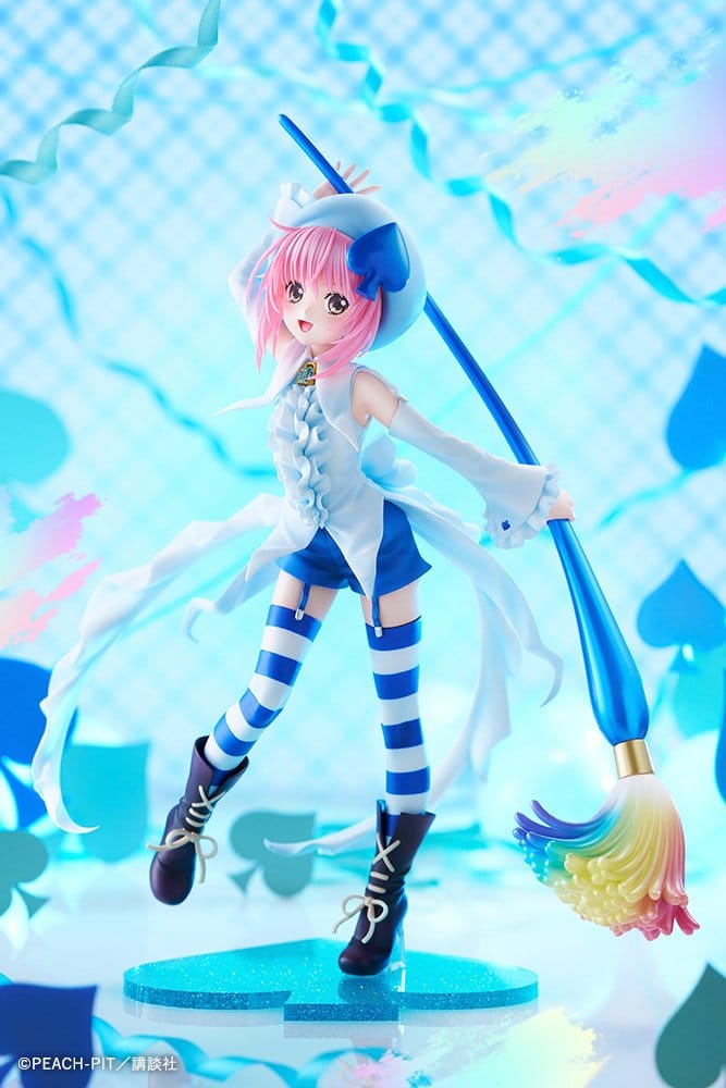 Amu Hinamori Amulet Spade figure posed against a bright blue checked and heart-print backdrop