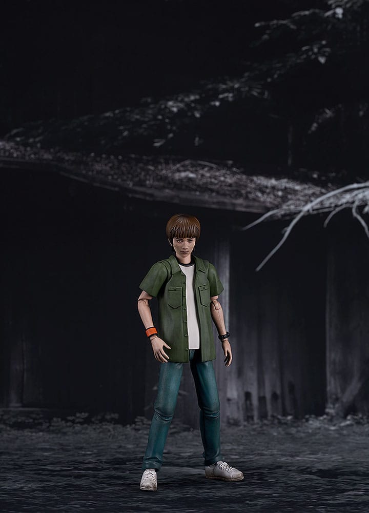 Kyoya Suda Plamatea kit standing in front of a dark wooden wall, horror game scene