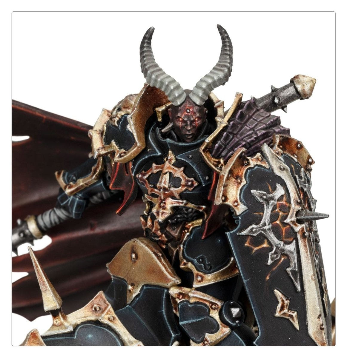 Close-up of Abraxia in horned helmet and spiked black armour with spear