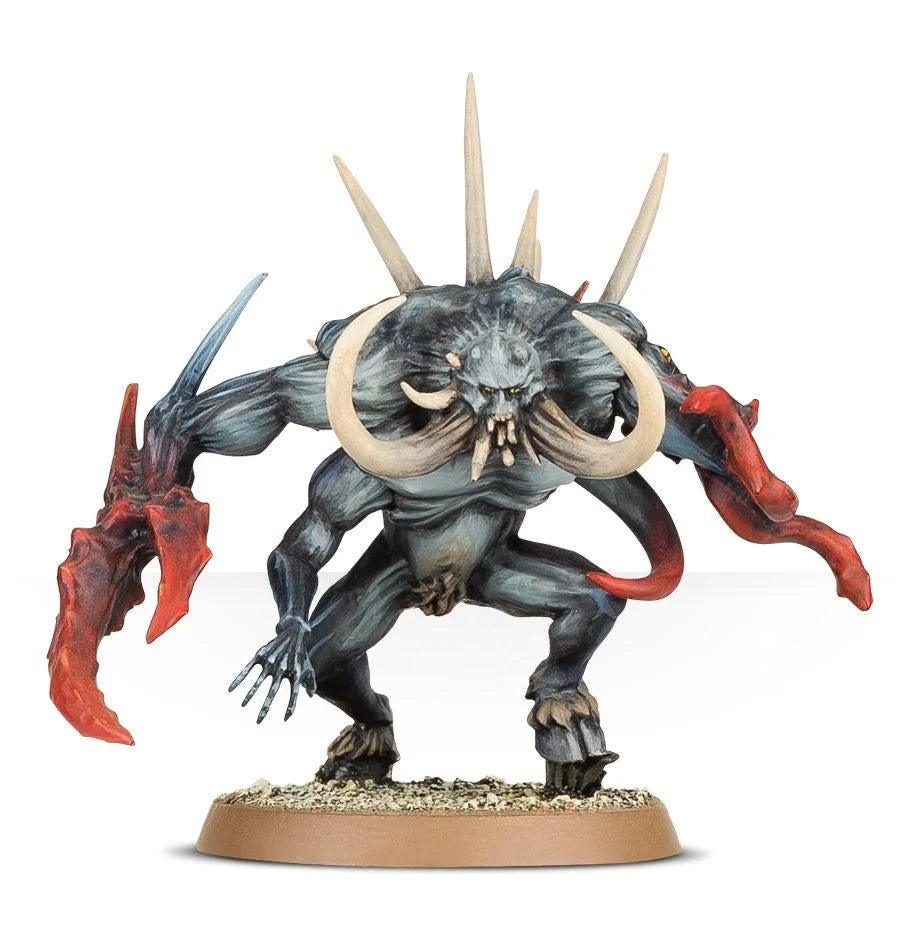Painted Chaos Spawn with blue-grey skin, curling tusks, horns and red crab-like claw
