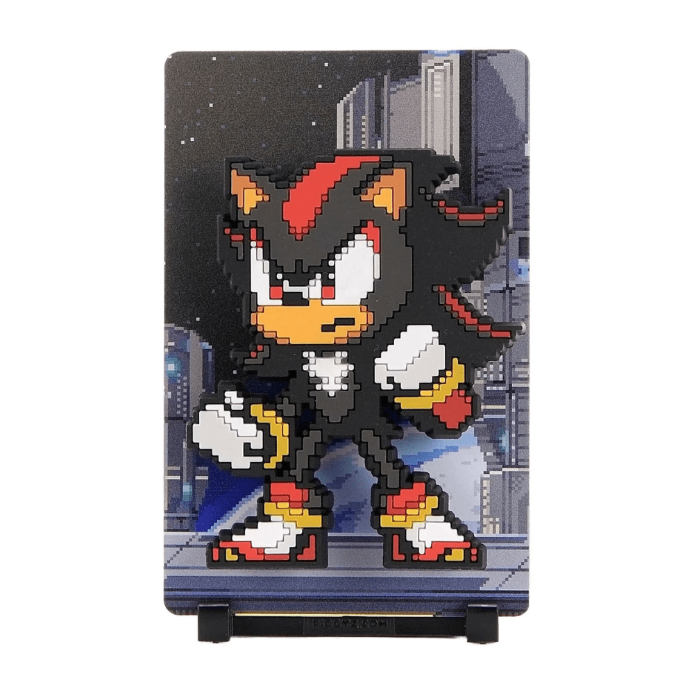 FiGGYZ Shadow the Hedgehog pixel-art magnet collectible on its stand, city backdrop