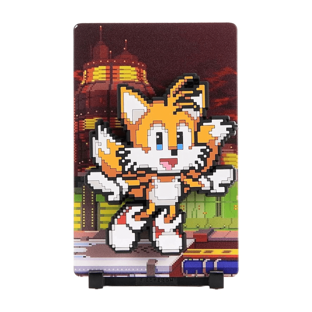 FiGGYZ Tails pixel-art magnet collectible on its stand with a city-at-night backplate
