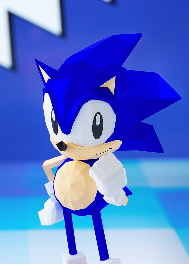 Close-up of Sonic the Fighters Ver. figure's angular blue quills and grin, blue backdrop