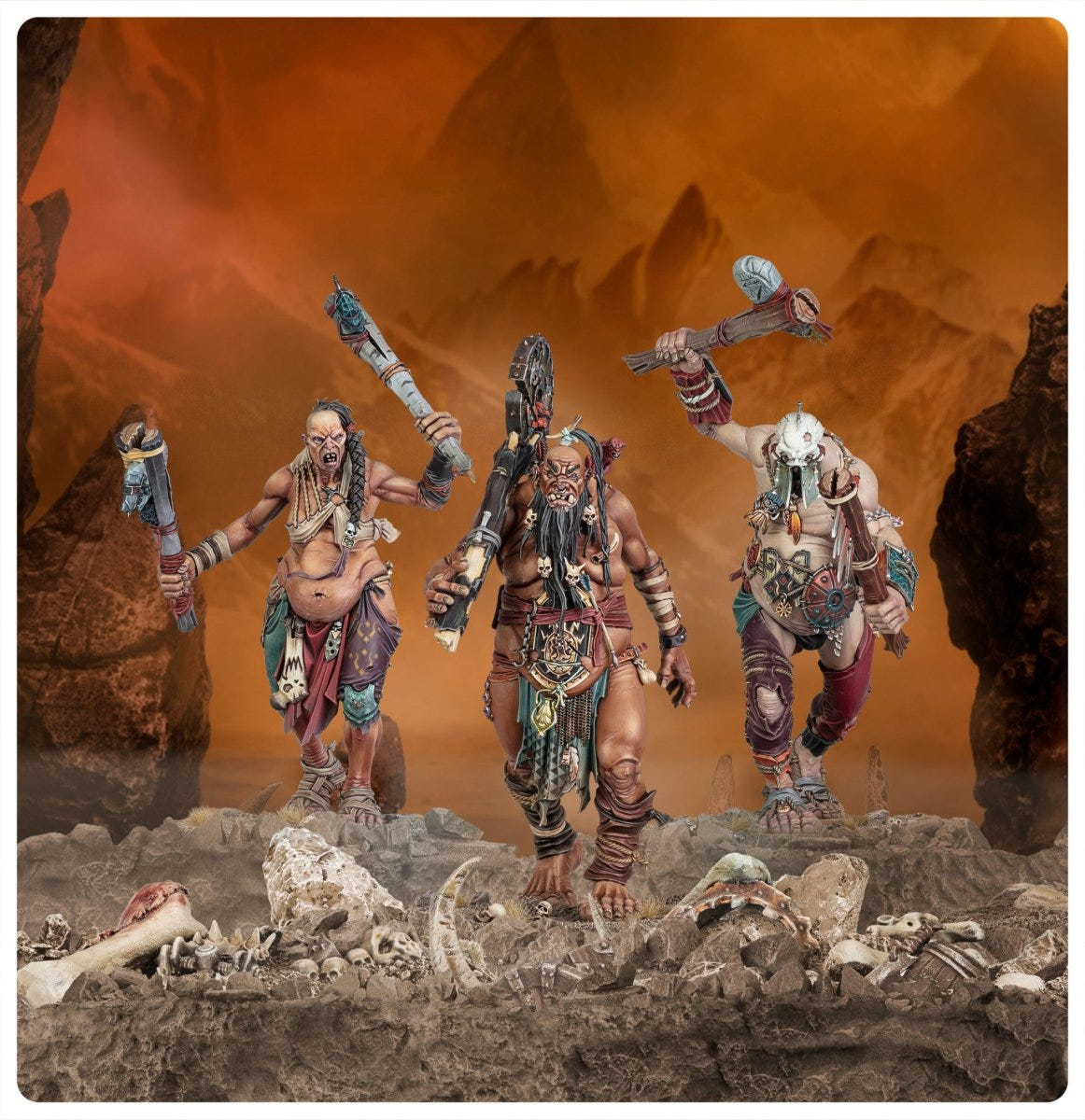 Three painted Sons of Behemat Boss-Stompers striding across a rocky, bone-strewn landscape