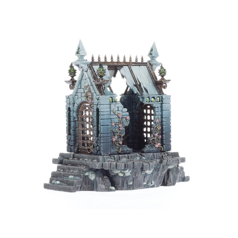 Ruined Cursed Sepulchre mausoleum in teal stone with collapsed walls and barred windows