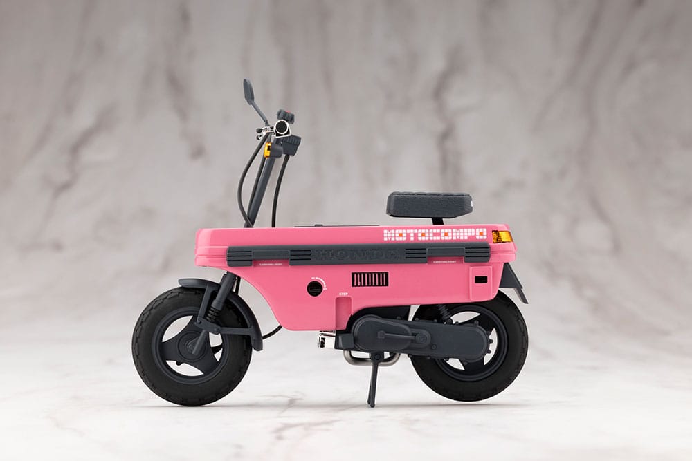 Pink Honda AB12 Motocompo scooter kit side profile view