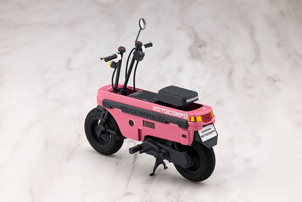Pink Honda AB12 Motocompo kit rear three-quarter view showing tail lights