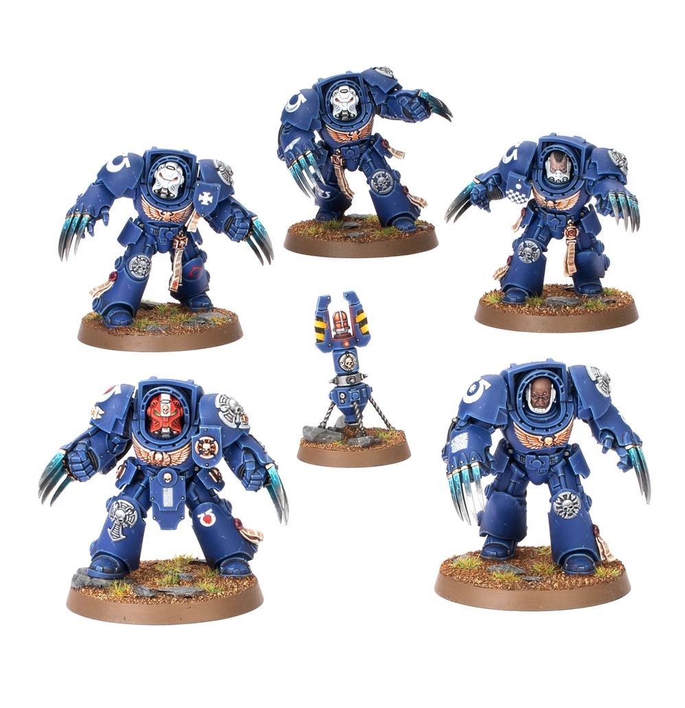 Five painted Ultramarines Assault Terminators with twin lightning claws, plus a teleport homer
