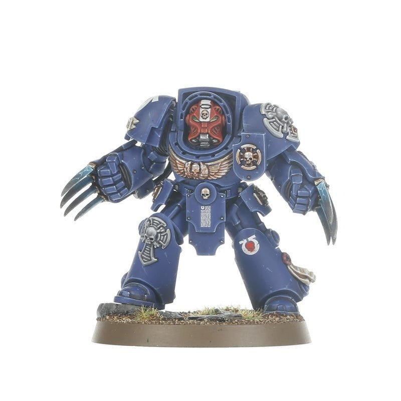 Painted Assault Terminator sergeant with red helmet and lightning claws