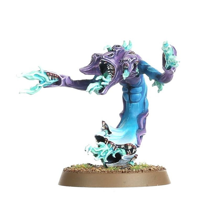 Painted blue-and-purple Tzeentch daemon with flaming hands and a gaping maw