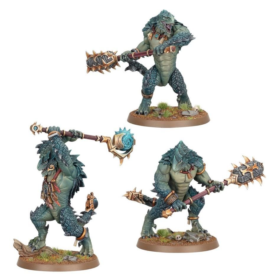 Three painted Seraphon Kroxigor in dark teal scales wielding huge maces and hammers