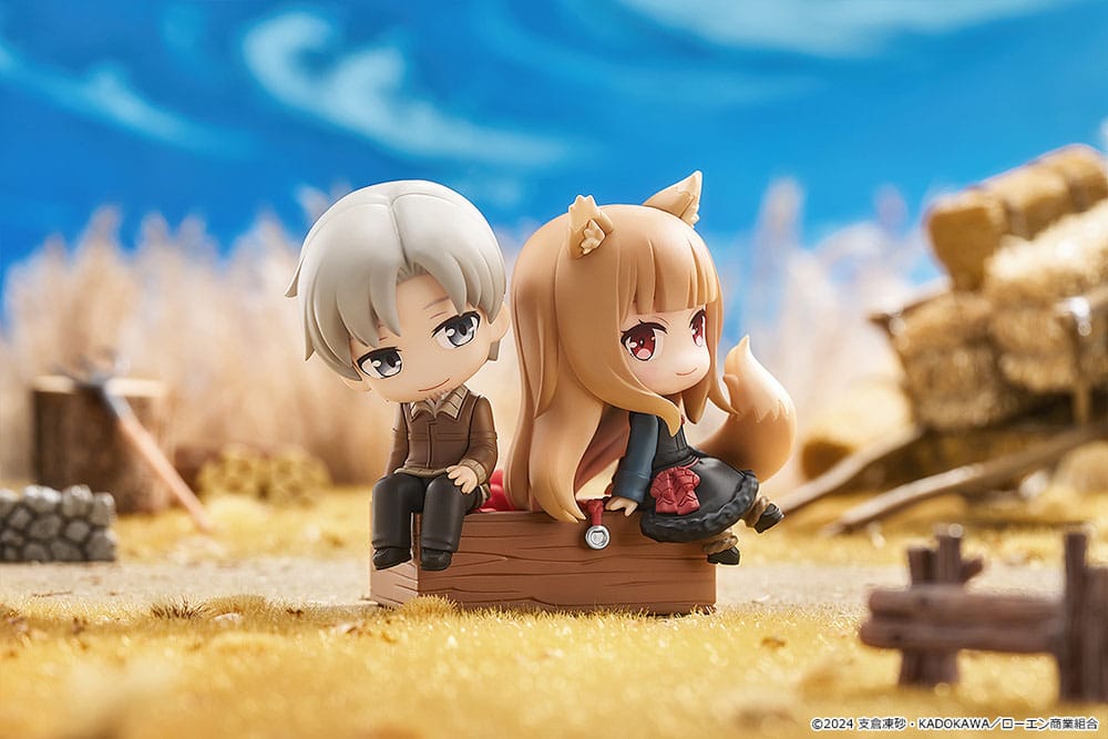 Spice and Wolf Mini Memory figure posed against a blue sky and haystack backdrop