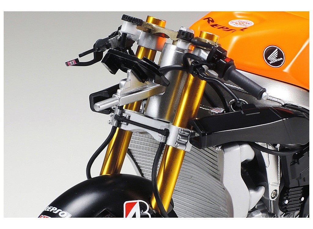 Tamiya 1/12 Honda RC213V 2014 Front Fork Set, fitted to the Repsol bike, close-up of gold forks