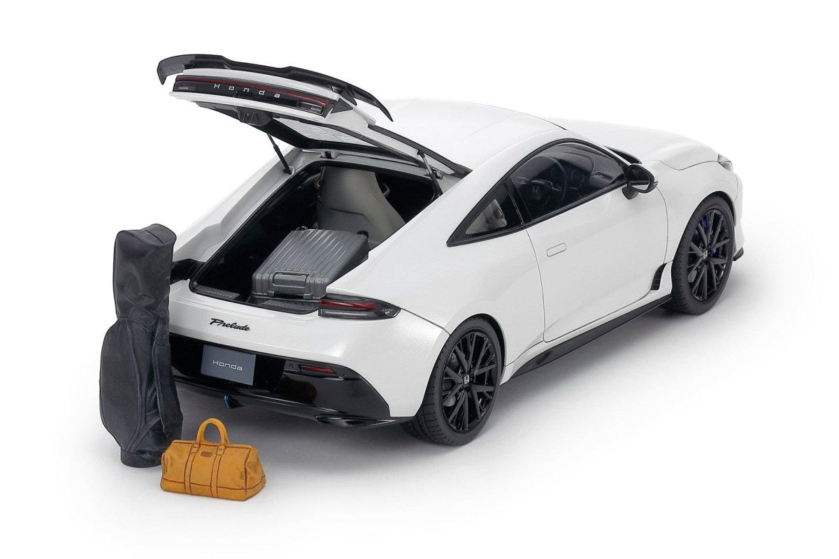 Tamiya 1/24 Honda Prelude 2025 kit, white build with tailgate open, golf bag and holdall beside it