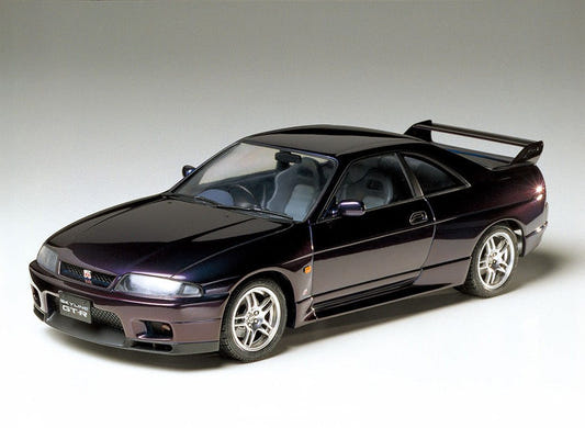Tamiya 1/24 Nissan Skyline GT-R V-Spec kit, built model in dark purple, front three-quarter view