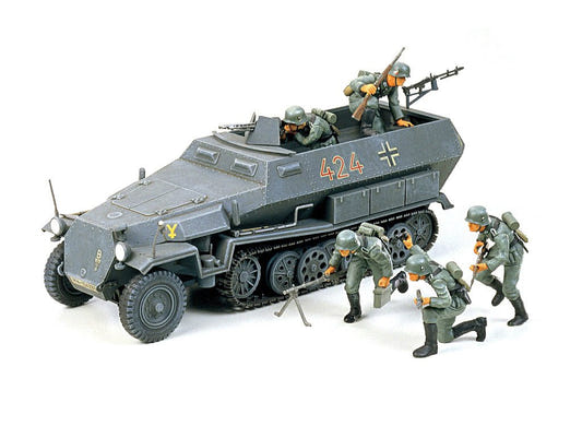 Tamiya 1/35 Hanomag Sd.Kfz.251/1 kit, built grey half-track with infantry figures on white