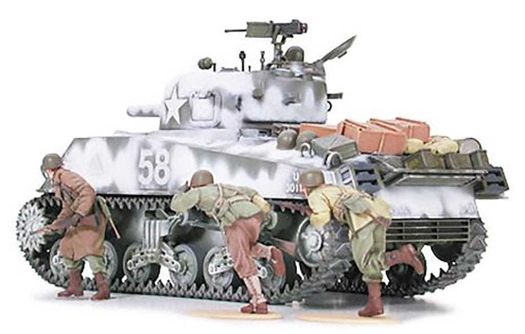 Tamiya 1/35 M4A3 Sherman 105mm Howitzer kit, built model rear three-quarter view with infantry advancing