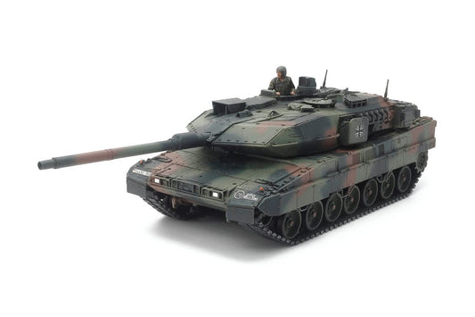 Tamiya 1/48 Leopard 2 A7V tank kit, built model in three-tone camouflage with commander figure, side view