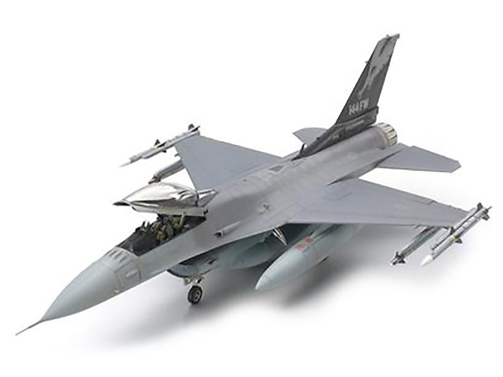 Tamiya 1/48 Lockheed F-16C Block 25/32 kit, built grey model with missiles, front three-quarter view