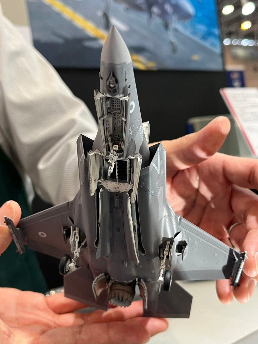 Tamiya 1/72 F-35B Lightning II kit, underside of the built model held in hands, showing weapons bays
