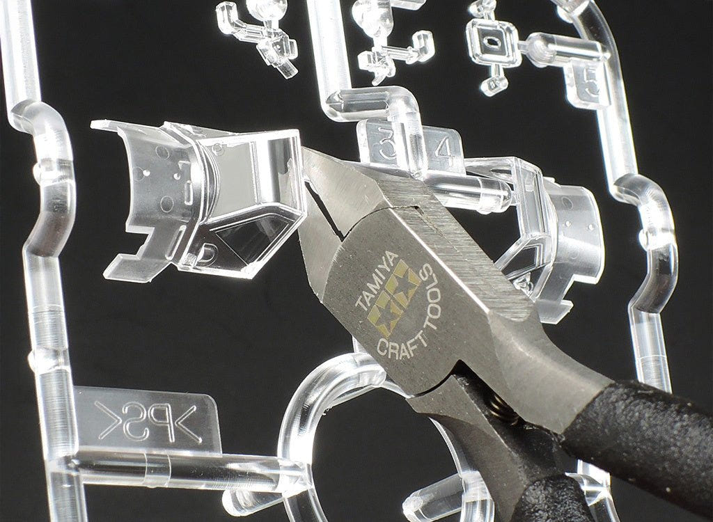 Tamiya Sharp Pointed Side Cutter cutting a clear part from a transparent sprue