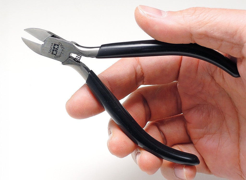 Tamiya side cutter for plastic, nippers held in a hand to show size
