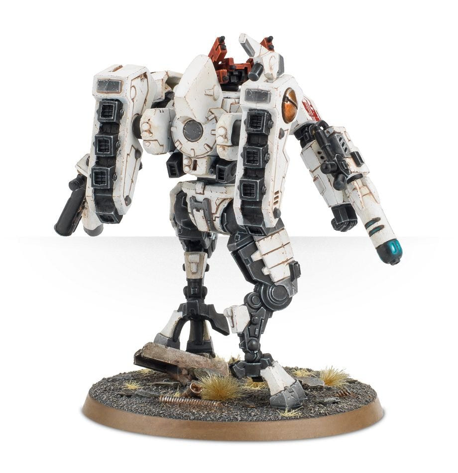 Rear three-quarter view of the T'au Commander showing jet pack and weapon arms