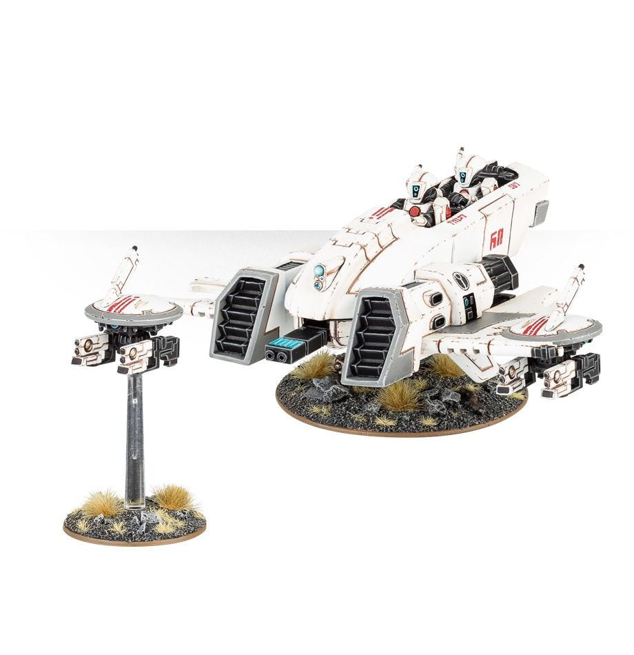 Painted T'au Piranha skimmer with a gun drone on a flight stand