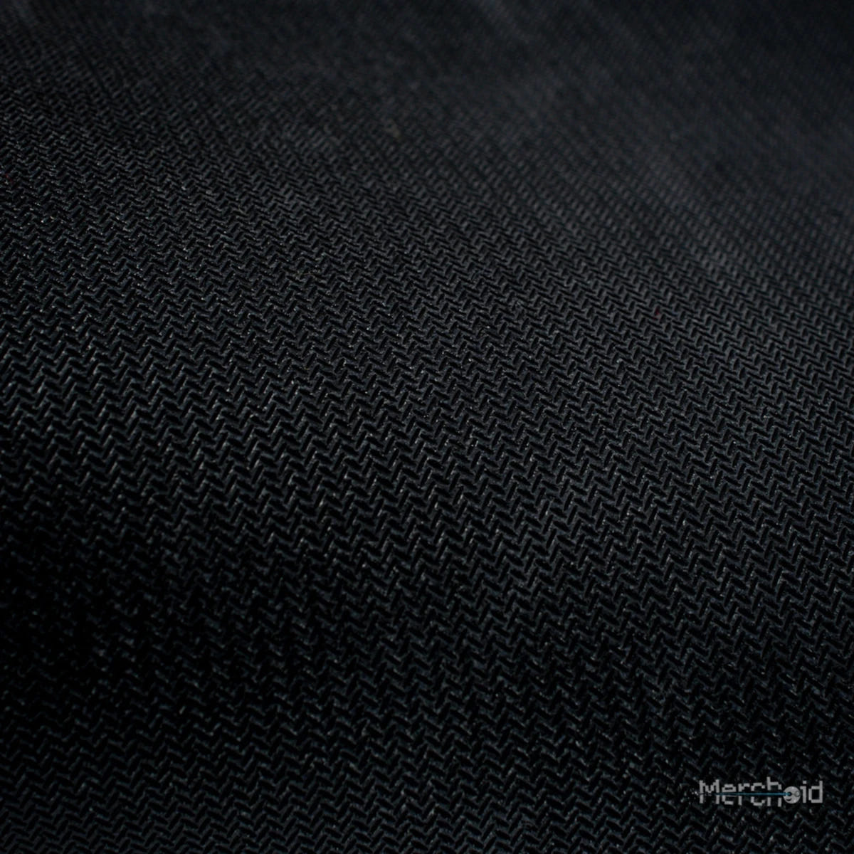 Close-up of the Horus Heresy desk mat's woven black fabric surface
