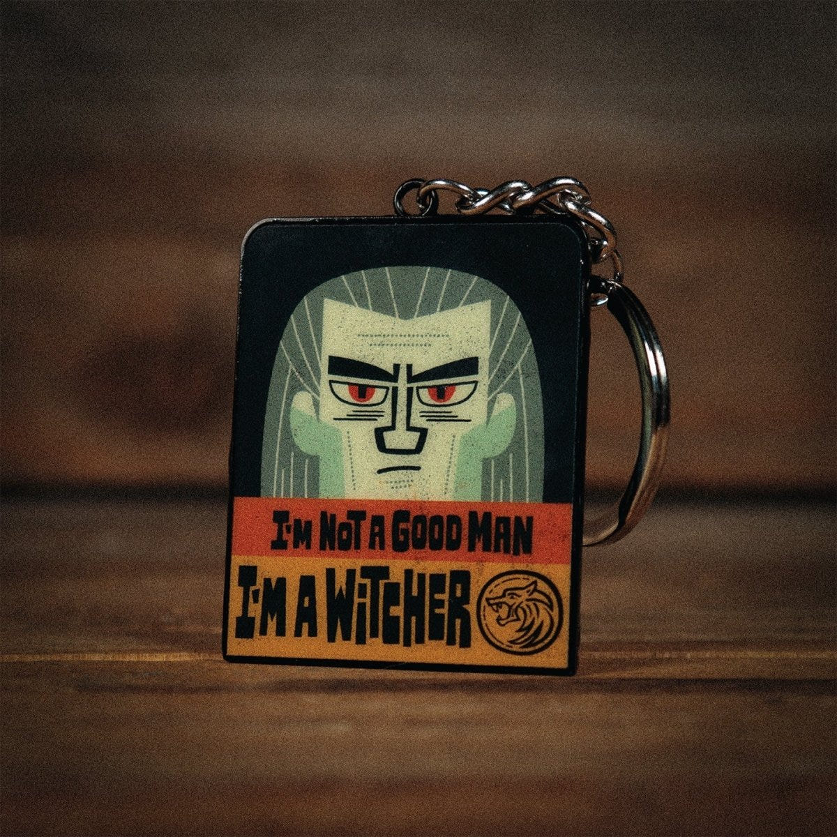 The Witcher keyring front showing Geralt of Rivia with the I'm Not a Good Man slogan