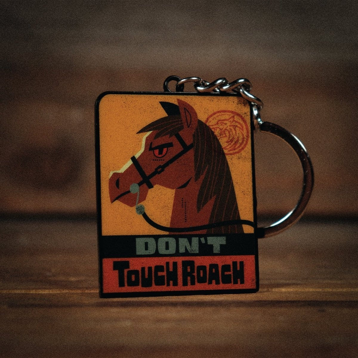 The Witcher keyring reverse showing Roach the horse with a Don't Touch Roach slogan
